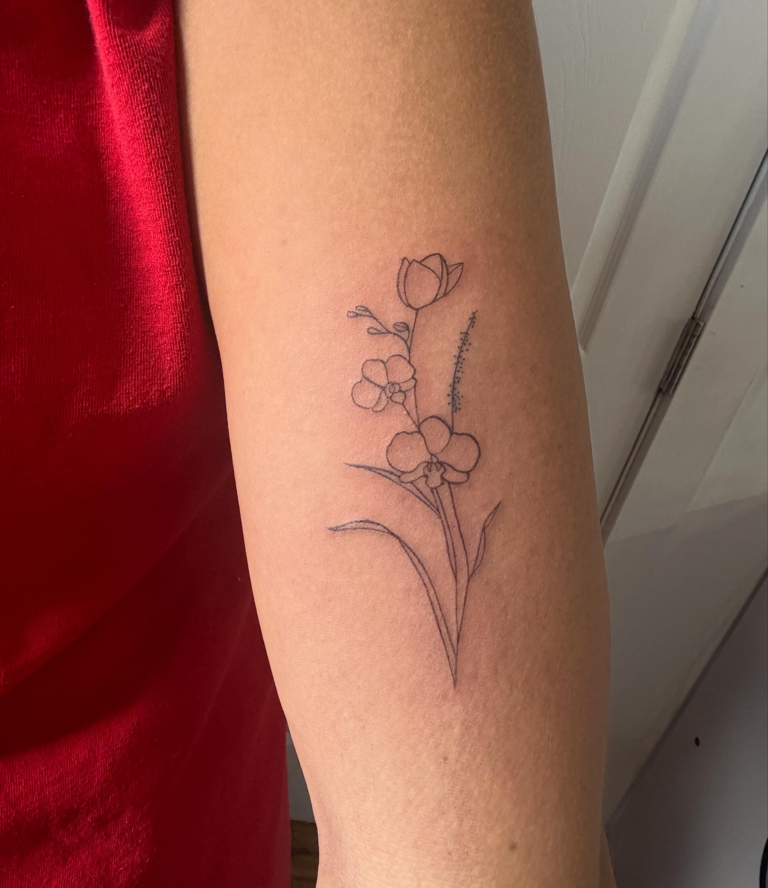 Fine line floral bouquet tattoo on arm by Makayla at Pretty in Ink Columbus Ohio