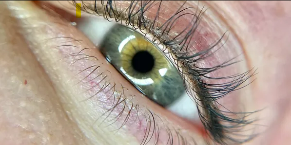 Close up of permanent lash line eyeliner tattoo
